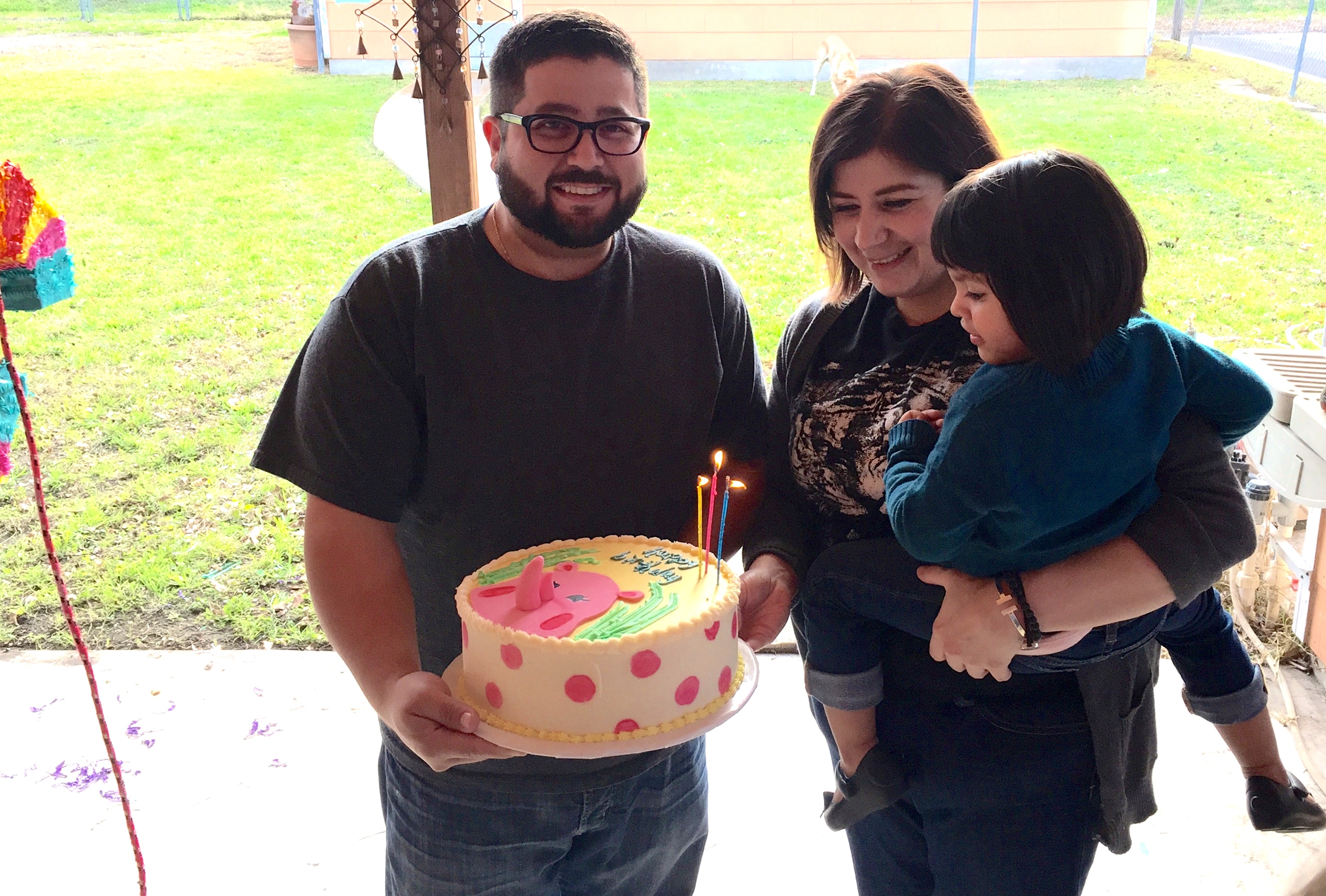 Milagro and her parents